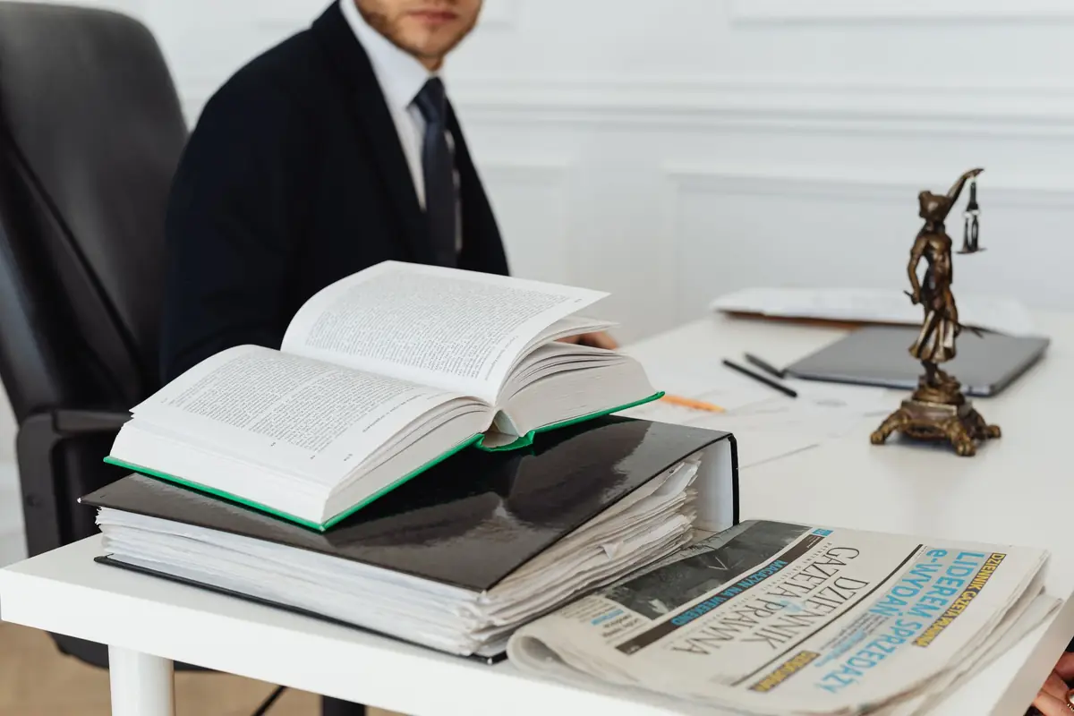 A law office desk with legal books and a gavel
